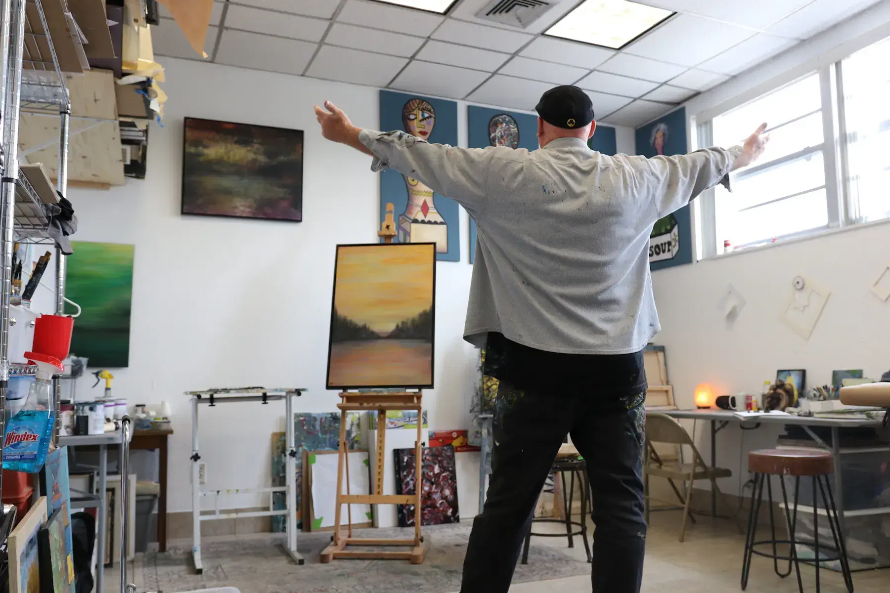 dennis hood posing in his art studio